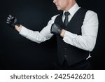 Small photo of Portrait of Vintage Violent Thug in Black Waistcoat and Leather Gloves in Fighting Stance. Back Alley Pugilist or Mafia Hit Man.