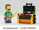 Small photo of Quezon City, Philippines - February 20, 2022: Lego Simpsons Minifigure Ned Flanders cooking sausages on a Lego grill 2