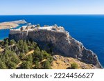 Small photo of Aerial view of the famouse tourist destination in rhodes island. Village Lindos, with the acropolis and the aegan sea. Dodecanese, Greece.