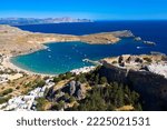 Small photo of Aerial view of the famouse tourist destination in rhodes island. Village Lindos, with the acropolis and the aegan sea. Dodecanese, Greece.