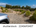 Small photo of Vacation with a rental car. 4x4 off-road Jeep Renegade on dirt road on Rhodes island. Typical greek landscape. Greece. October 09, 2022