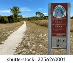 Small photo of Gulf Islands National Seashore, Florida -2023: Northern Terminus of Florida Trail. Florida National Scenic Trail runs from Big Cypress National Preserve to Gulf Islands National Seashore. Trail marker