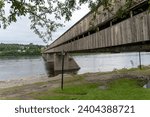 Small photo of Hartland, New Brunswick -Jun 1, 2023: The Hartland Covered Bridge is the world's longest covered bridge. It crosses the Saint John River from Hartland to Somerville, New Brunswick, Canada.