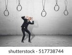 Small photo of A businessman surrounded by ties drawn on the wall, which look like nooses. Face serious challenges. Difficulties and problems in business. Go crazy because of an intractable situation.