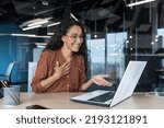 Small photo of Happy hispanic businesswoman working in modern office using laptop for video call and online meeting with fellow employees, woman smiling and having fun giving a presentation