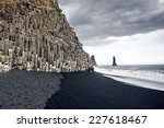 The black sand beach of Reynisfjara and the mount Reynisfjall from the Dyrholaey promontory in the southern coast of Iceland.