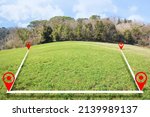 Small photo of Building lot on hilly land - Land plot management - Real estate concept with a vacant land on a green field available for building construction and housing subdivision in a residential area