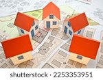 Small photo of New home and free vacant land for building activity - Construction industry and building permit concept with a residential area, cadastral map, General Urban Planning and zoning regulations