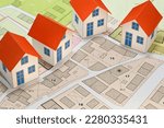 New home and free vacant land for building activity - Construction industry and building permit concept with a residential area, cadastral map, General Urban Planning and zoning regulations  