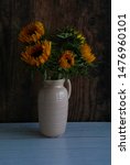 Vase Of Sun Flowers On Rustic...