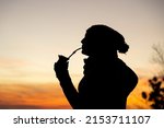 Silhouette Of A Woman With A...