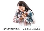 Small photo of Young woman with a sudden heart attack, holding her chest tightly in the heart area. Isolated on white.
