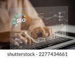 Small photo of Website admins using SEO tools to get their websites ranked in top search rankings in search engine. Website improvement concept to make search results higher.