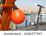 Small photo of blurred life buoy with a buoy in the stern of the ship on a background of a tropical beeg