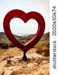 Small photo of Vicar, Almeria, Spain; July 11, 2021: views of the village of Vicar framed in a heart in the Viewpoint of Love. And the greenhouses of western Almeria in the background.