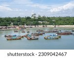 Small photo of Dar es Salaam, Republic of Tanzania - April 21: Old wooden fishing boats on the coast of Dar es Salaam city on April 21, 2023 in Tanzania, Republic of Tanzania.