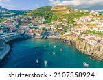 Small photo of Aerial drone view of Camara de Lobos village panorama near to Funchal, Madeira. Small fisherman village with many small boats in a bay