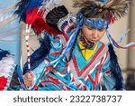 Small photo of Calgary, AB, Canada. Jun 24, 2023. A medium shot of an indigenous young man talent showcase wearing a colourful traditional cloths. National Indigenous Family Day and POW WOW. Aboriginal Awareness
