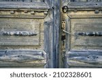 Small photo of Old scrappy door with doorknob
