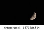 Small photo of Panorama of decrescent moon on the night sky
