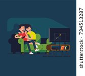 young couple watching scary... | Shutterstock .eps vector #734513287