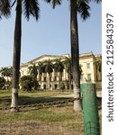 Small photo of HAZARDUARI, MURSHIDABAD, WEST BENGAL, INDIA on 12th. February 2022 ai 13:03 pm. View from garden foreground of Hazarduari Palace Museum Gate founded by Nawab Nazim Humayun Jah.