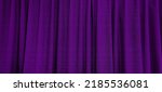 Small photo of close up view of dark purple curtain in thin and thick vertical folds made of black out sackcloth fabric, panoramic view of drapery use as background. abstract theatre backgrounds and wallpapers.