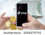 Small photo of Russia Moscow 20.05.2021 FTX logo in mobile phone.Cryptocurrency decentralized exchange DEX.Trading blockchain platform.Swap,buy,sell crypto token,digital coin Bitcoin,Ethereum.Business,investing.