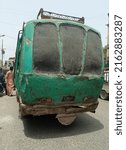 Small photo of The back of an old scrappy mini bus on the road - Karachi Pakistan - May 2022