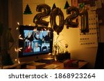 Virtual Christmas New Year's meeting team teleworking. Family video call remote conference. Laptop screen view. 2021 meet working from their home offices. Happy hour party online woman team diversity