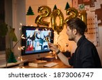 Celebrate New Year's Eve At Home This Year. Host a video call with loved ones. Virtual toast with your friends. Entertainment at remote call and decorate foiled balloons of 2021.