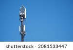 Small photo of Technology on the top of the telecommunication GSM 5G, 4G, 3G tower.Cellular phone antennas on a building roof.silhouette of Telecommunication mast television antennas.