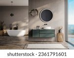 Small photo of modern bathroom with beige and soil tone walls, white bathtub, green vanity, black mirror, sink, terrazzo floor, and a view of the pool and sea from the window