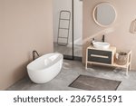 Small photo of Modern minimalist bathroom interior, modern bathroom cabinet, white sink, wooden vanity, interior plants, bathroom accessories, bathtub and shower, white and beige walls, concrete floor.
