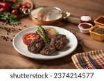 Small photo of Meatball plate, Roasted peppers, Roasted tomatoes, Roasted onions and meatballs plate, Barbecued meatballs, Meatball plate on wooden table, grilled meatballs, Delicious composition