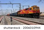 Small photo of Ateli, Haryana, India - April 25, 2021: Diesel Locomotive Engine of Indian Railways travelling at a slow speed.