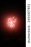 Small photo of People enjoying a fireworks display on July 4th in Willamina, Or.
