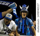 Small photo of Toronto, Canada - Aug 1, 2019: Toronto Argonauts fans celebrating Argonauts winning touch down during WInnipeg Blue Bombers at Toronto Argonauts game at BMO Field in Toronto, ON