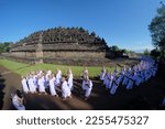 Small photo of borobudur, indonesia - december 17th 2022 : the monks are performing a buddhist religious ritual called pradaksina which is circling borobudur temple clockwise three times by praying