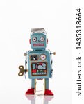 Vintage Robot Tin Toy On Yello...
