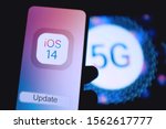 Small photo of New iphone with the apple installation screen with the new IOS 14 operating system next to supposedly come out with 5G. Sunday, November 17, 2019, New York, United States.