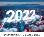 2022 year manipulated city with digital network line link metaverse era concept. Cyberpunk futuristic theme color. World business trend of data connect in blockchain system.