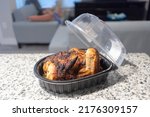 Small photo of supermarket rotisserie chicken packed to go