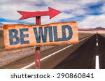 Be Wild sign with road background