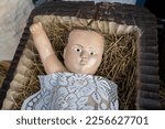 Small photo of Trzebinia, Lesser Poland, Poland - 11 January 2023: statue of baby Jesus in manger that is part of the Christmas nativity scene in the main square