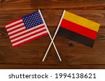 Flag of USA and flag of Germany crossed with each other. USA vs Germany. The image illustrates the relationship between countries. Photography for video news on TV and articles on the Internet and media