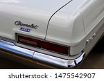 Small photo of Union Grove, Wisconsin / USA - August 10, 2019: The Nickey Chevrolet dealership emblem above the right rear taillight on this beautiful 1966 Chevy Biscayne with a 427 cubic inch big block.