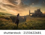 hooded man looking at the fantasy landscape castle