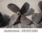 Detail of a large old four-bladed ship propeller from the Second World War