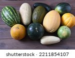 Small photo of harvest of watermelons and melons, melons torpedo, Collective farmer, Ethiopian, Gulyabi and Piel de Sapo, watermelons Baby, Black Prince, Orange on the table